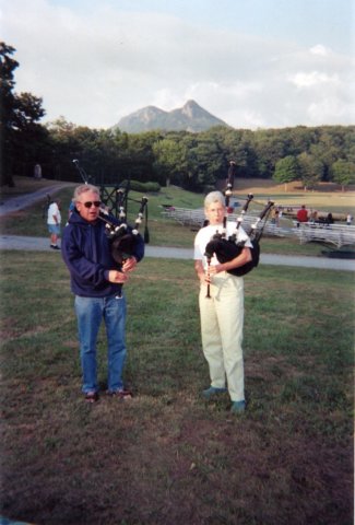 janetplaysbagpipesinfrontofgrandfathermountainjune2006.jpg